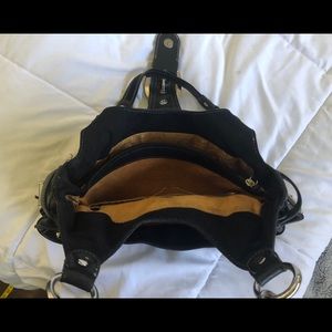 Kathy Van Zeelund Black leather shoulder bag.